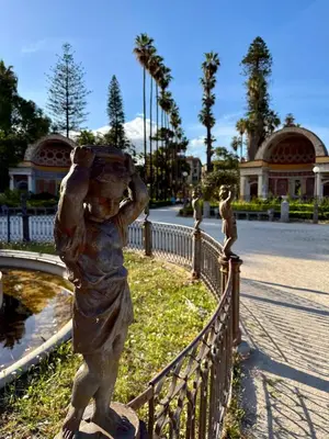 a statue of a woman leaning on a fence at Appartamenti Pellegrino Centro in Palermo