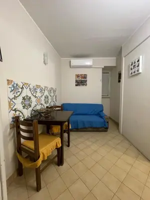 a small room with a table and a bed at Norman City House in Palermo