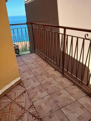 a balcony with a view of the ocean at Sonalerba Ammare Trabia H H in Trabia