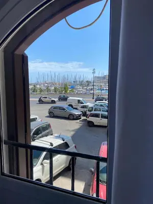 a view from a window of a parking lot at B&B Al Porto Home in Palermo