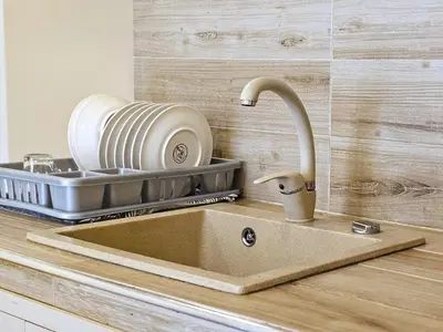 a kitchen counter with a sink and a slicer at Duomo Suite - A Step from the Cathedral in Monreale