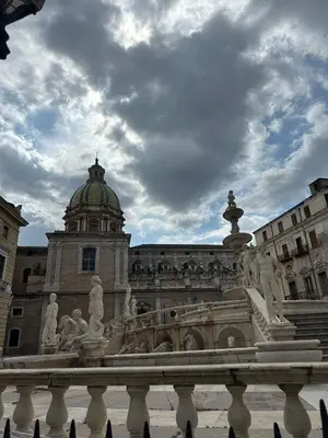 a building with a fountain in front of it at Mart Rental Apartament in Palermo