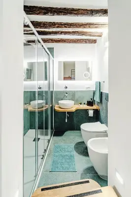 a bathroom with two sinks and two toilets at N'amuri in Palermo