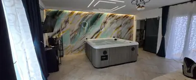 a bathroom with a sink and a painting on the wall at The Moon Suite in Palermo