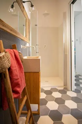a bathroom with a sink and a shower at Il Moro & La Dama in Palermo