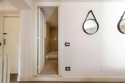 a bathroom with a mirror on the wall at Appartamento Sammartino by Wonderful Italy in Palermo