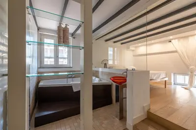a bathroom with a large tub and a sink at Appartamento Sammartino by Wonderful Italy in Palermo