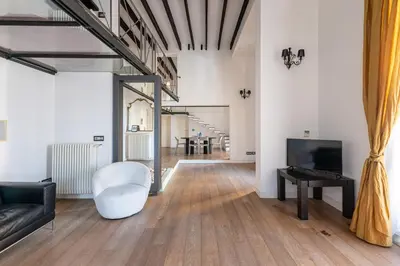 a living room with a couch and a television at Appartamento Sammartino by Wonderful Italy in Palermo
