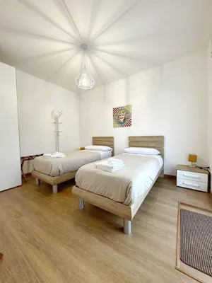a room with two beds and a ceiling at Casa Ragonese in Palermo