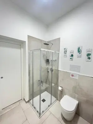 a bathroom with a shower and a toilet at Casa Bontà in Palermo