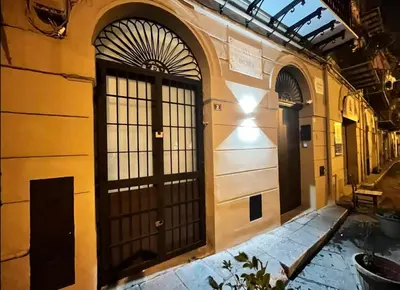 an entrance to a building with two doors at Casa Bontà in Palermo