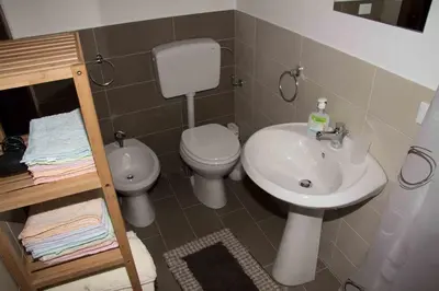 a bathroom with a toilet and a sink at Casa Vacanza Isola di Eufemio in Capaci