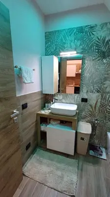 a bathroom with a sink and a mirror at Sogni D'oro 01 in Partinico