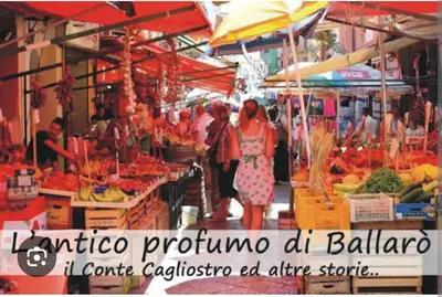 a group of people walking through a market with fruits and vegetables at INFINITY Luxury Apartment in Palermo