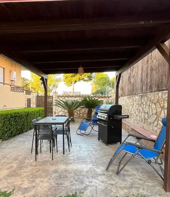 a living room with a couch and a tv at A Casa Da Mari' in Terrasini