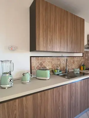 a kitchen with a stove and a counter top at A Casa Da Mari' in Terrasini