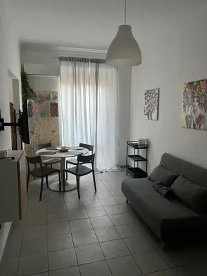 a living room with a couch and a table at Appartamento Ciccio al Capo in Palermo