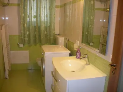 a bathroom with a sink and a toilet at Casa vacanze Giusi in Castellammare del Golfo