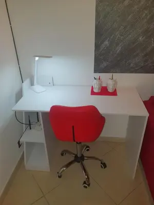 a white desk with a red chair in front of it at Casa vacanze Giusi in Castellammare del Golfo