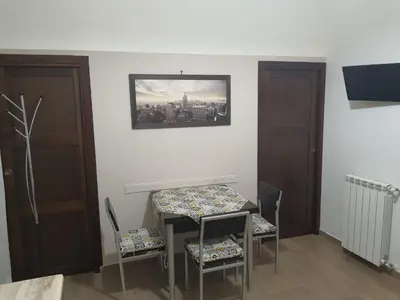 a dining room with a table and two chairs at Casa Vacanza Isola di Eufemio Piano Terra in Capaci
