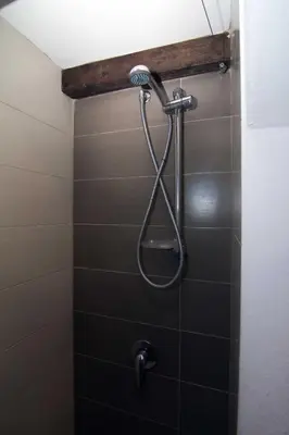 a shower with a shower head in a bathroom at Casa Vacanza Isola di Eufemio Piano Terra in Capaci