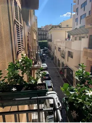 a city street with cars parked on a balcony at Sperlinga Suite in Palermo