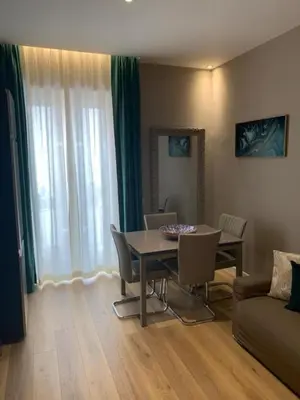 a living room with a table and chairs and a couch at Sperlinga Suite in Palermo