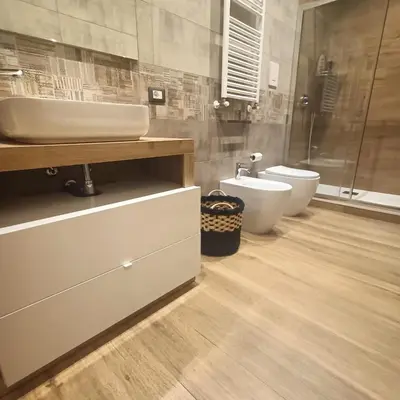 a bedroom with a bed with towels on it at Borgese Apartments in Palermo