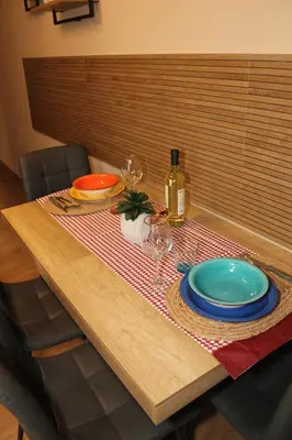 a living room with a television on a table at Borgese Apartments in Palermo