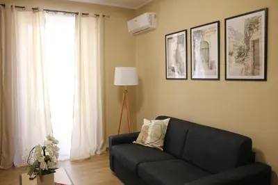 an empty room with a sliding glass door at Borgese Apartments in Palermo