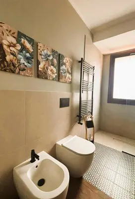 a bathroom with a toilet and a sink at Gira e Firria in Palermo