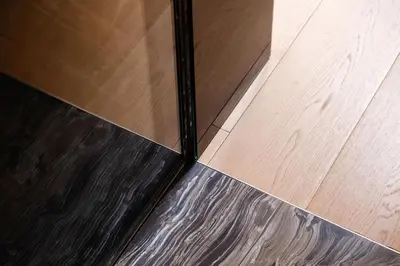 a glass door on top of a wooden floor at G Cave 125 Boutique Apartment in Palermo