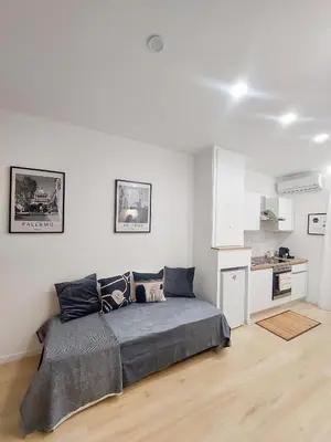 a bedroom with a bed in a white room at Da Vera Apartment in Palermo