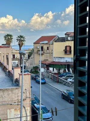 a view of a city street with cars parked at La Casa di Alan in Palermo