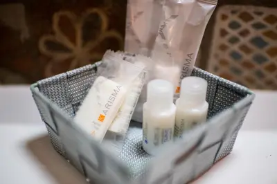 a basket filled with bottles of soap and other products at La Nicchia in San Vito lo Capo