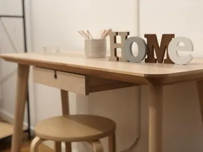 a wooden sign on a table with a stool at Charme Rooms Palermo-By E&K in Palermo