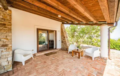 an external view of a patio with chairs and a table at Nice Apartment In Collesano Pa in Lascari