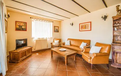 a living room with a couch and a tv at Nice Apartment In Collesano Pa in Lascari
