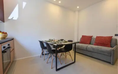 a living room with a table and a couch at Stunning Apartment In Trappeto in Trappeto