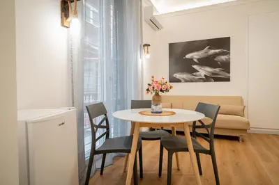 a living room with a couch and a table at Palermo Centro Sampei in Palermo