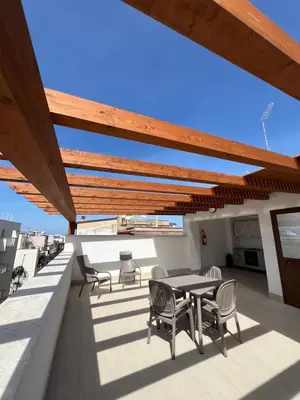 a large living room with a couch and a television at Appartamenti Via Meli in Balestrate
