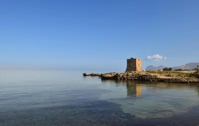 a castle on an island in the water at Stunning Apartment In Trappeto With Wifi in Trappeto