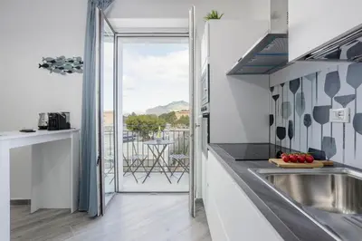 a kitchen with a view of a balcony at Erasmo home luxury, Palermo in Palermo