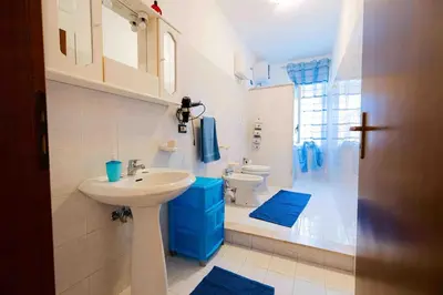 a bathroom with a sink and a toilet and a shower at Liberia vacanze - A POCHI PASSI dal mare in Alcamo