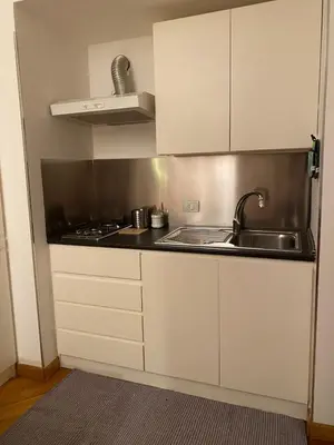 a kitchen with a sink and a stove at Cate Home historic center in Palermo