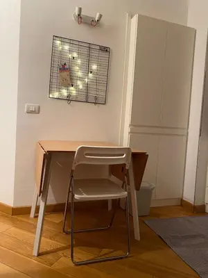 a desk and a chair in a room at Cate Home historic center in Palermo