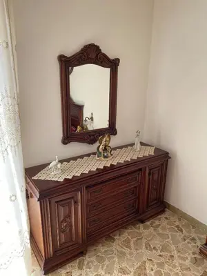 a dressing table with a mirror and stuffed animals on it at La Dimora della Maestra in Vita