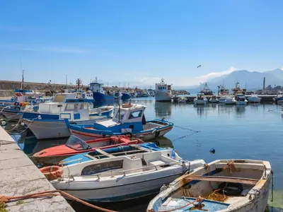 a bunch of boats are docked in a harbor at Apartment Cicladi Santorini by Interhome in Santa Flavia