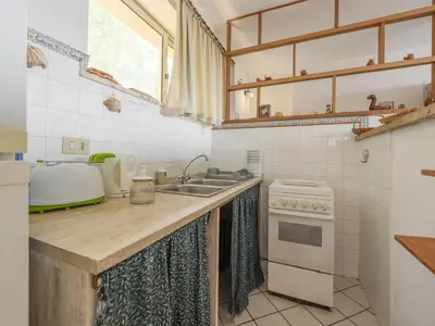 a kitchen with a sink and a stove at Apartment Cicladi Santorini by Interhome in Santa Flavia