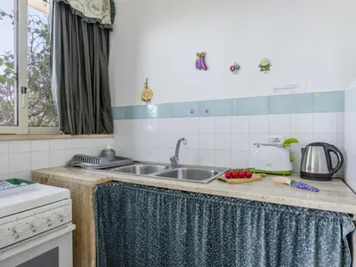a kitchen with a sink and a counter top at Apartment Cicladi Kea by Interhome in Santa Flavia